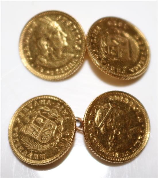 A pair of gold coin cufflinks